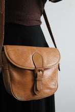 cognac leather saddle bag