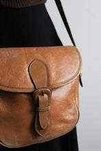 cognac leather saddle bag