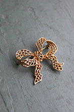 golden bow brooch