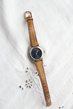 leather band vintage watch