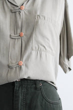 stone button up