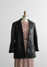 button-front black leather jacket